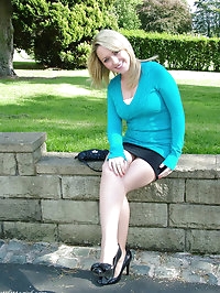 Sexy little blonde showing off her sexy stilettos outdoors